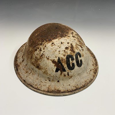 Lot 245 - A Second World War ACC helmet.