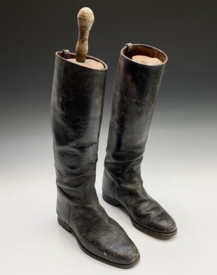 Lot 404 - A pair of black leather riding boots, with...