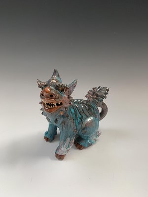 Lot 57 - A Japanese earthenware shishi or temple dog,...