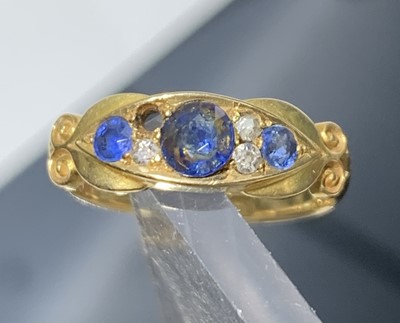 Lot 473 - A Victorian 18ct gold ring set three sapphires...