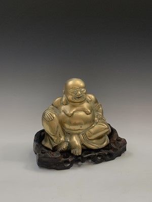Lot 144 - A Chinese brass model of a seated buddha,...