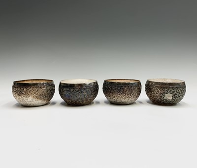 Lot 1024 - A set of four Burmese silver bowls, early 20th...