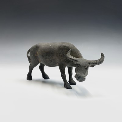 Lot 239 - A Chinese bronze sculpture of a buffalo,...
