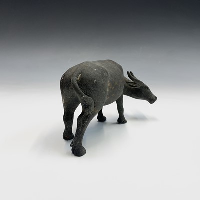 Lot 239 - A Chinese bronze sculpture of a buffalo,...