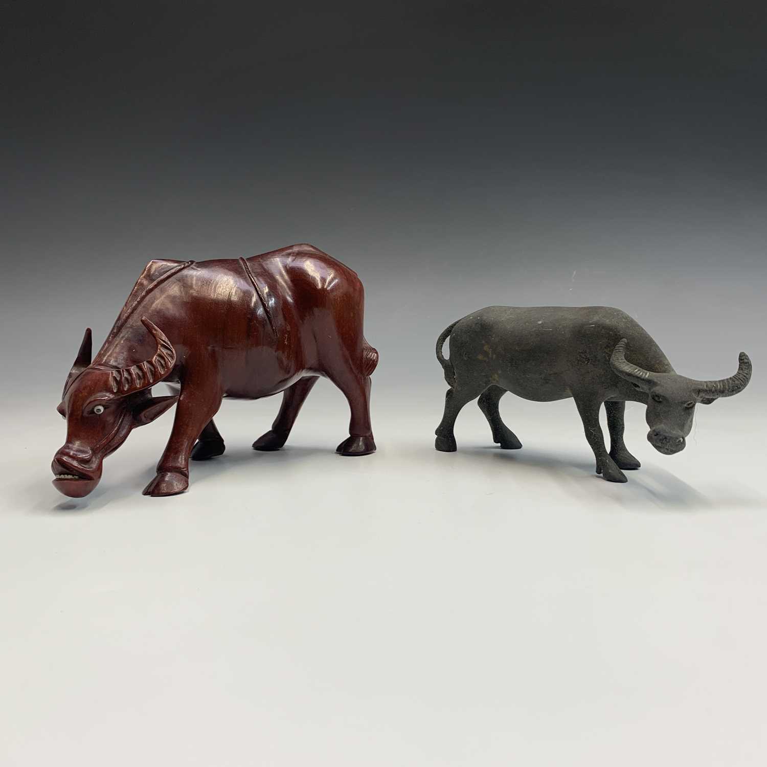 Lot 239 - A Chinese bronze sculpture of a buffalo,...