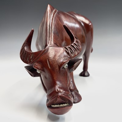 Lot 239 - A Chinese bronze sculpture of a buffalo,...