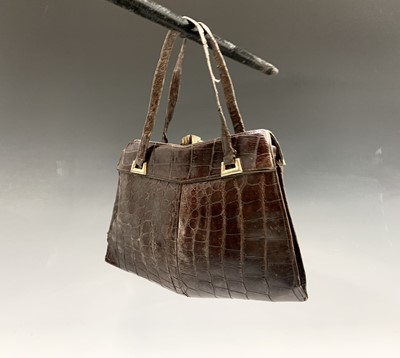 Lot 210 - A crocodile handbag and a cigarette case with...