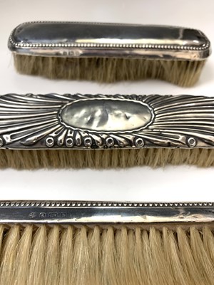 Lot 36 - A silver-mounted mirror and three...