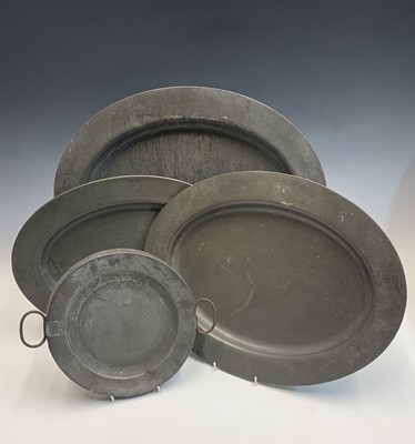 Lot 681 - A matched set of three graduated pewter oval...