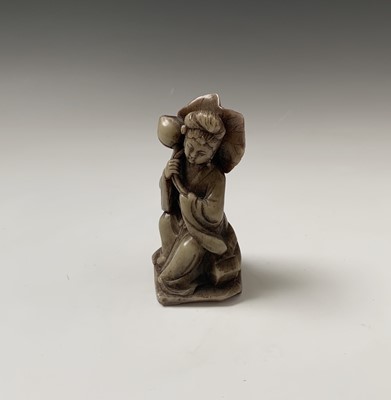 Lot 211 - A Chinese soapstone figure, of a seated female,...