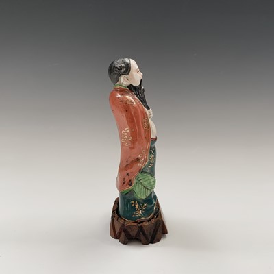 Lot 173 - A Chinese porcelain figure of an immortal,...