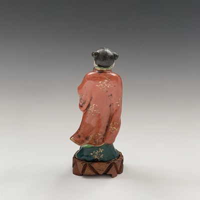 Lot 173 - A Chinese porcelain figure of an immortal,...