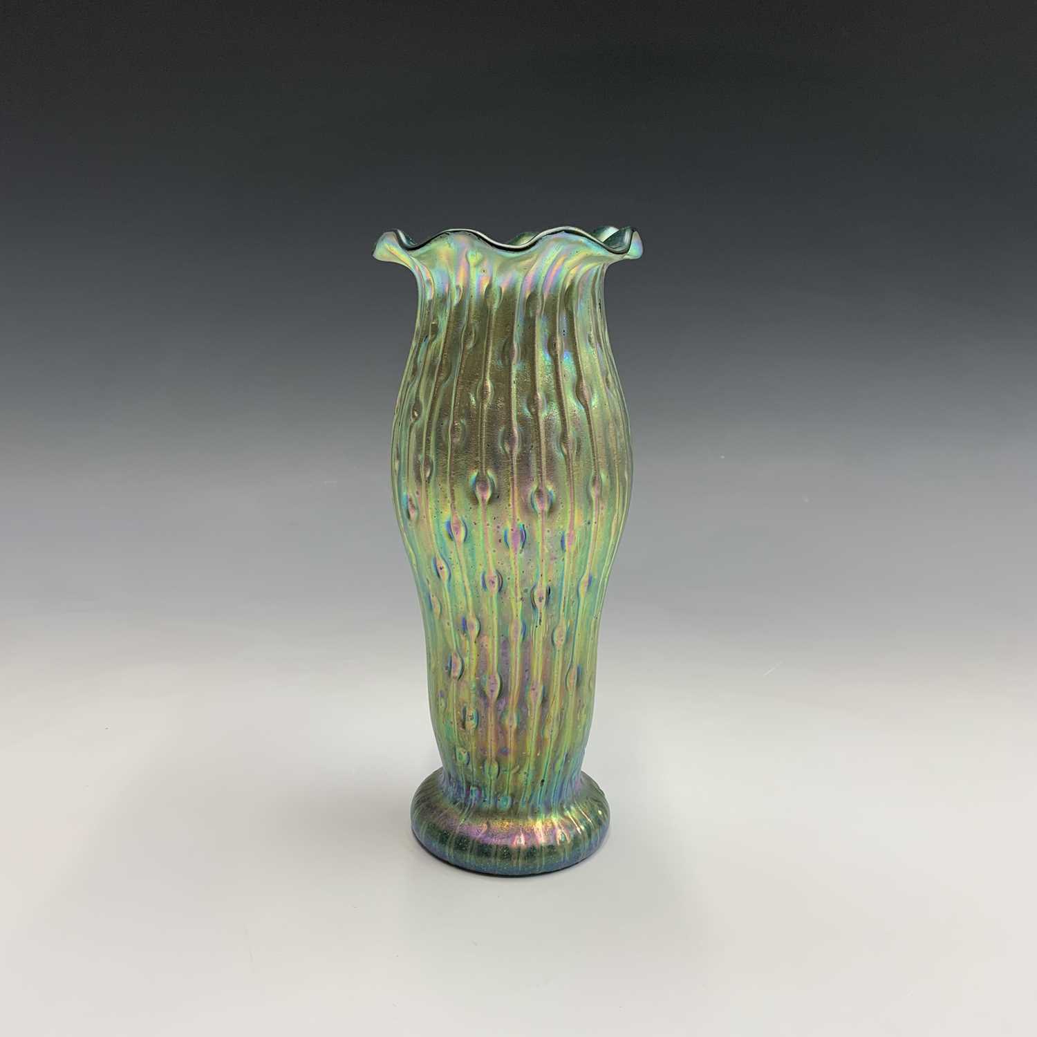 Lot 959 - A Loetz type iridescent green glass vase,...