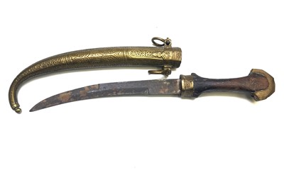 Lot 531 - A Jambuka knife, the black hardwood handle...