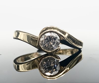 Lot 55 - An 18ct gold diamond solitaire contemporary...