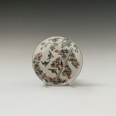Lot 129 - A Japanese porcelain cup and saucer, Meiji...