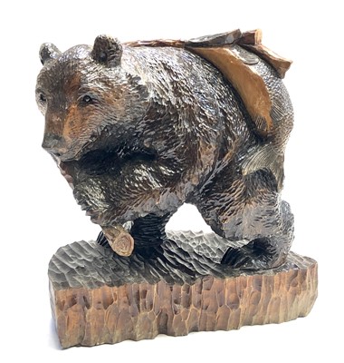 Lot 533 - A Black Forest carving of a bear with a salmon,...