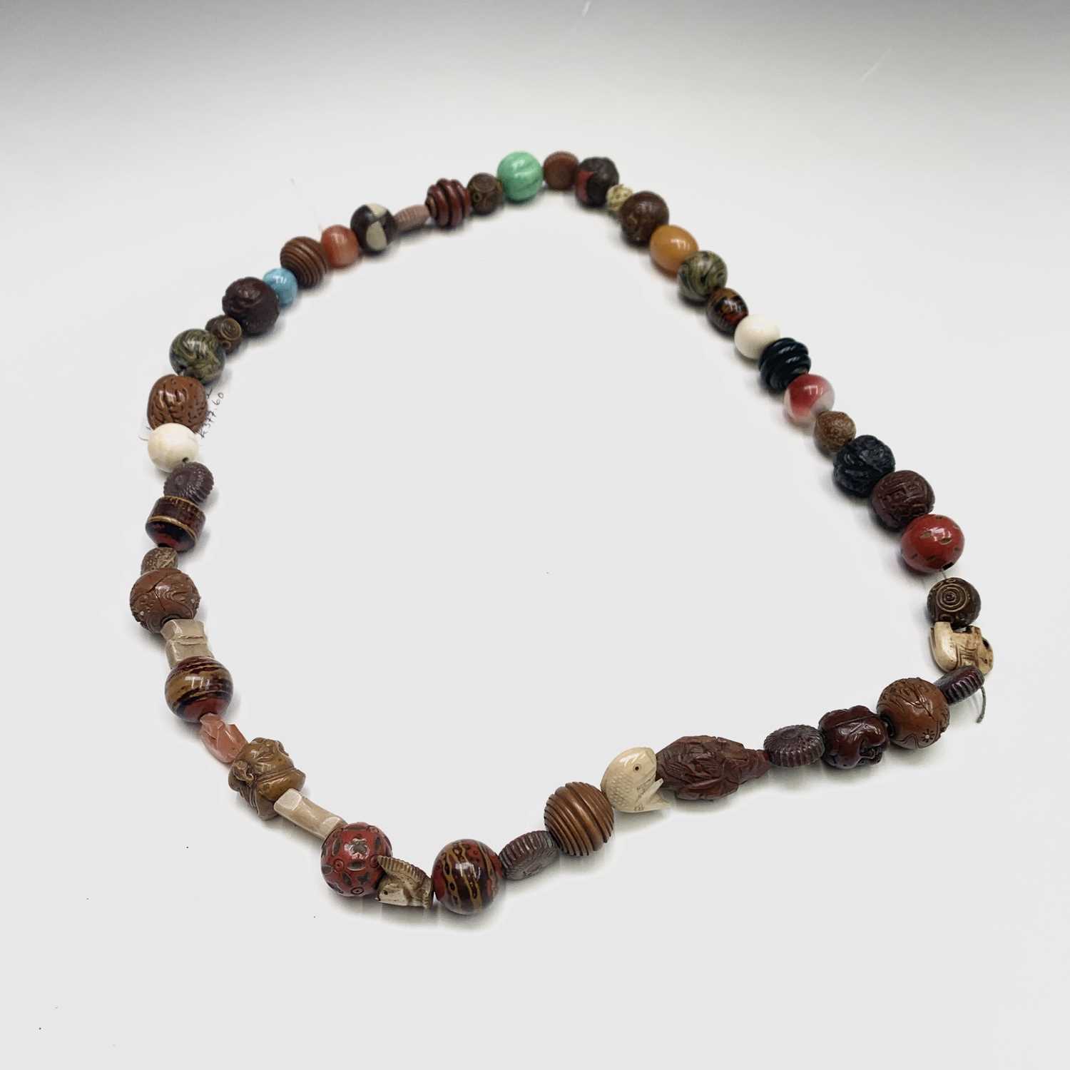 Lot 280 - A Japanese ojime bead necklace, length 39cm.