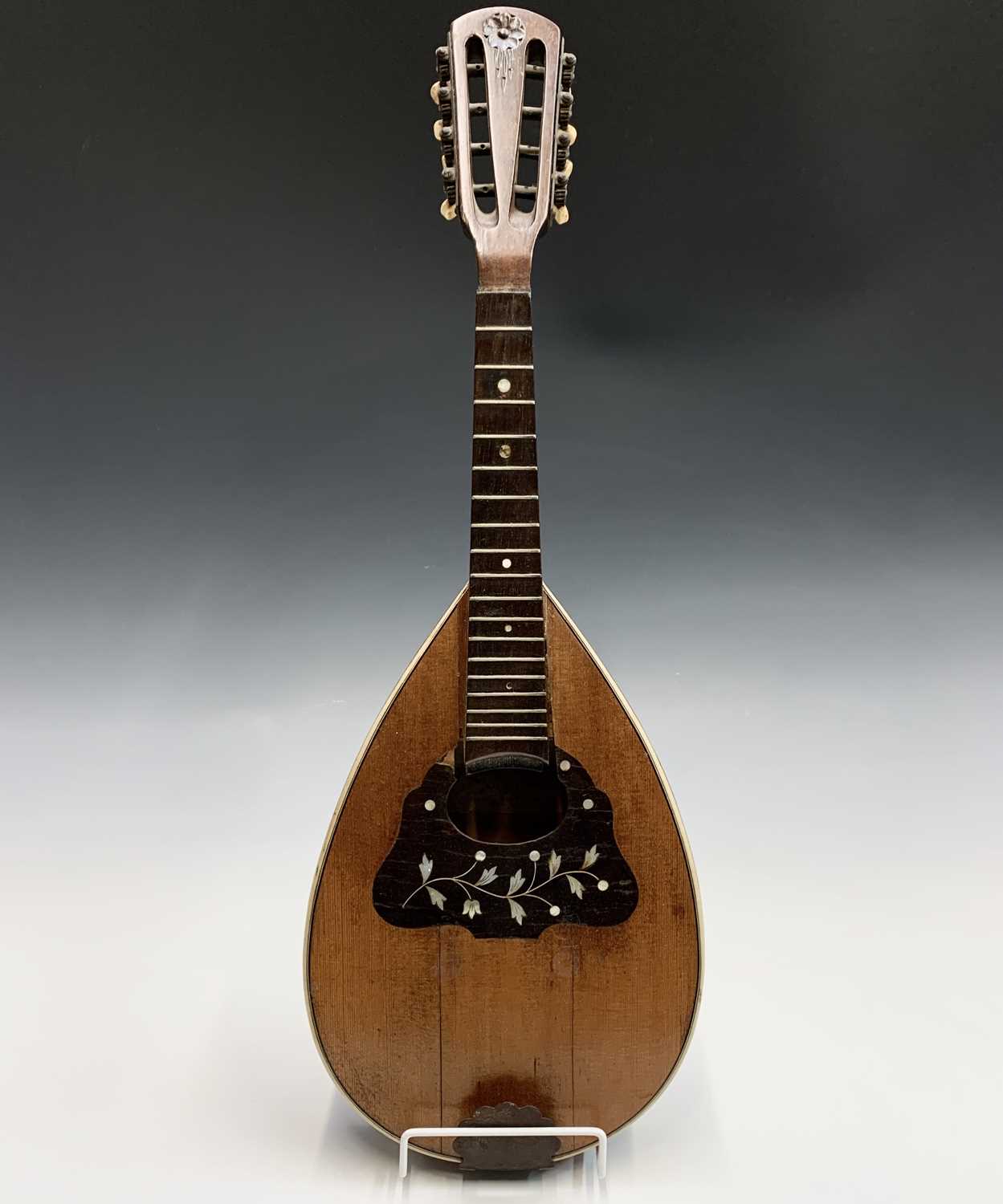 Mandolin Labelled Lot 313 - An Indian eight string mandolin, labelled