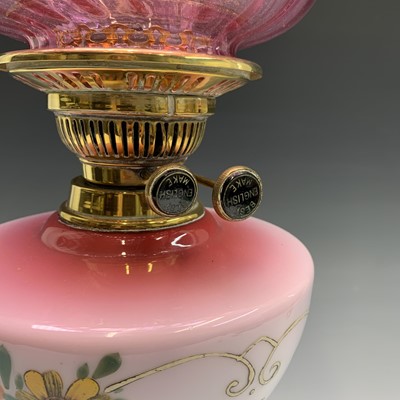 Lot 296 - A Victorian oil lamp, with floral painted pink...