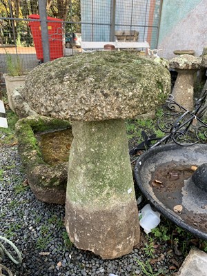 Lot 2034 - A granite staddle stone with circular top and...