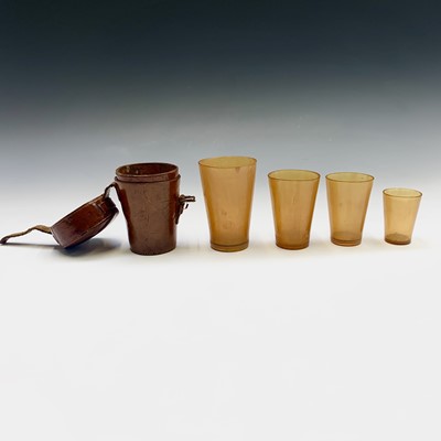 Lot 305 - A set of 19th century graduated horn cups, the...