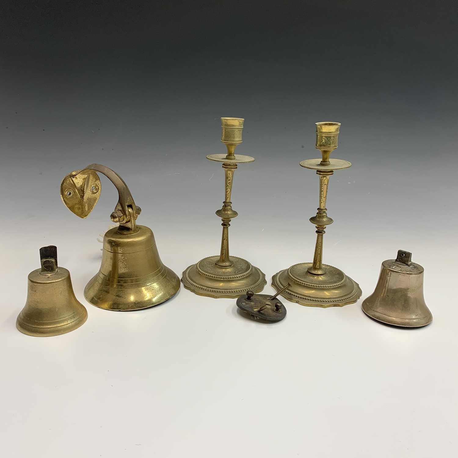 Lot 596 - A brass bell, height 14cm overall, a near pair...