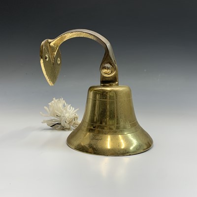 Lot 596 - A brass bell, height 14cm overall, a near pair...