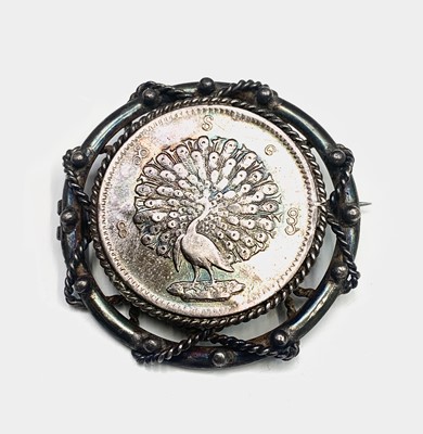 Lot 417 - A Silver brooch set a Burmese silver peacock...