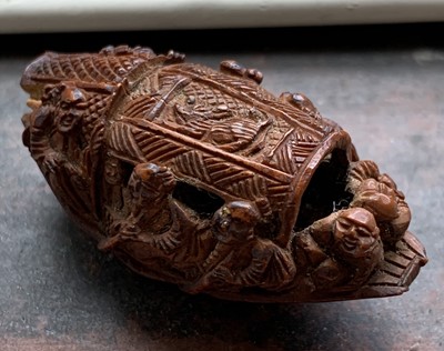 Lot 279 - A Chinese carved betel nut bead, length 4cm.