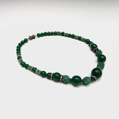 Lot 229 - A Chinese spinach jade necklace, length 20cm.