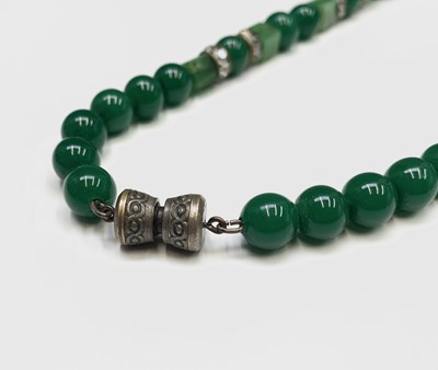 Lot 229 - A Chinese spinach jade necklace, length 20cm.