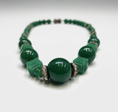 Lot 229 - A Chinese spinach jade necklace, length 20cm.