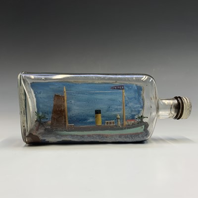 Lot 323 - A model boat ('Peter') in bottle. Length 20cm.