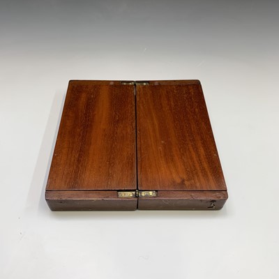 Lot 337 - A mahogany folding travel chess set, circa...