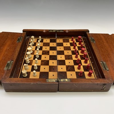 Lot 337 - A mahogany folding travel chess set, circa...
