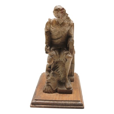 Lot 189 - A Black Forest carved wood figure of a seated...