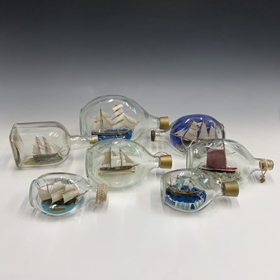 Lot 349 - A collection of eight model ships in bottles....