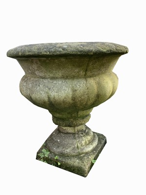 Lot 2028 - A pair of reconstituted stone pedestal garden...