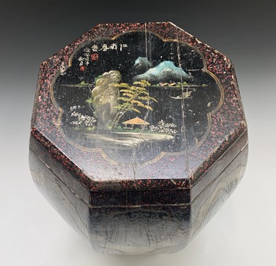 Lot 234 - A Japanese black lacquer octagonal barrel in...