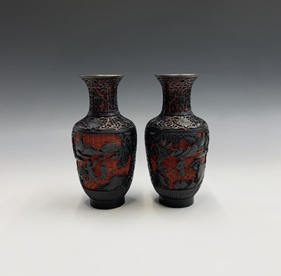 Lot 236 - A pair of Chinese red and black carved...
