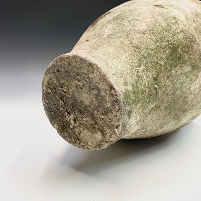 Lot 385 - A terracotta olive jar with green glazed rim....