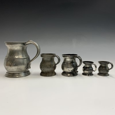 Lot 598 - Three pewter candle wall sconces, height 27cm,...