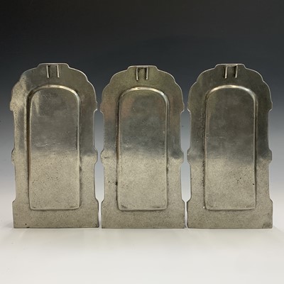 Lot 598 - Three pewter candle wall sconces, height 27cm,...