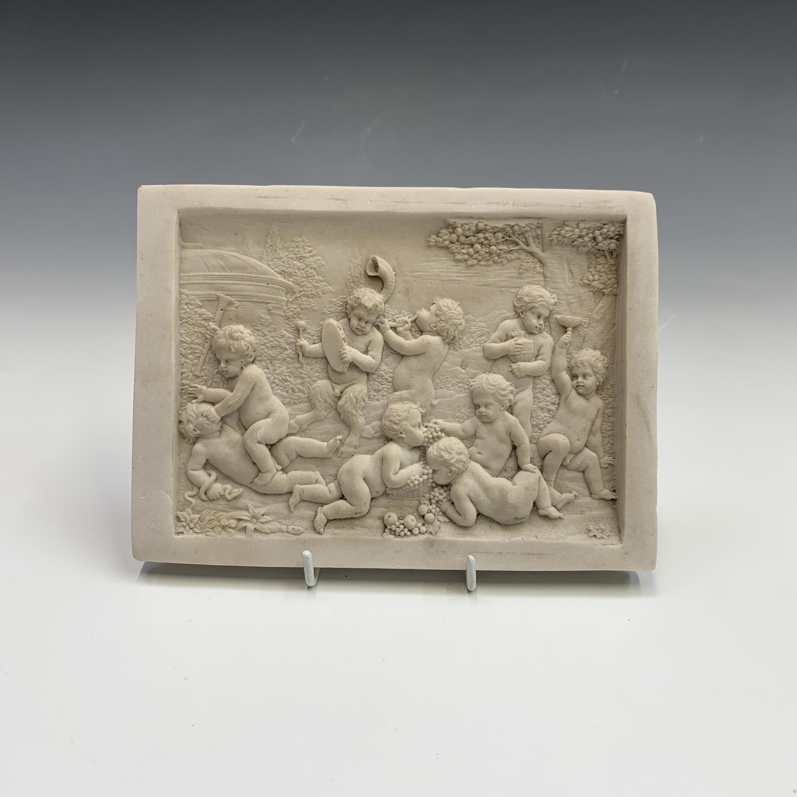 Lot 546 Two reconstituted marble plaques decorated