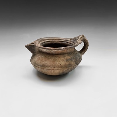Lot 1013 - An unusual Middle Eastern earthenware jug,...