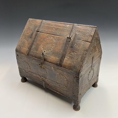 Lot 493 - An Eastern carved hardwood casket, with iron...