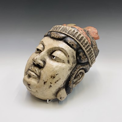 Lot 287 - A Japanese papier mache mask, attached paper...