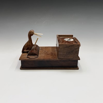 Lot 291 - A Japanese wood novelty cigarette dispenser,...