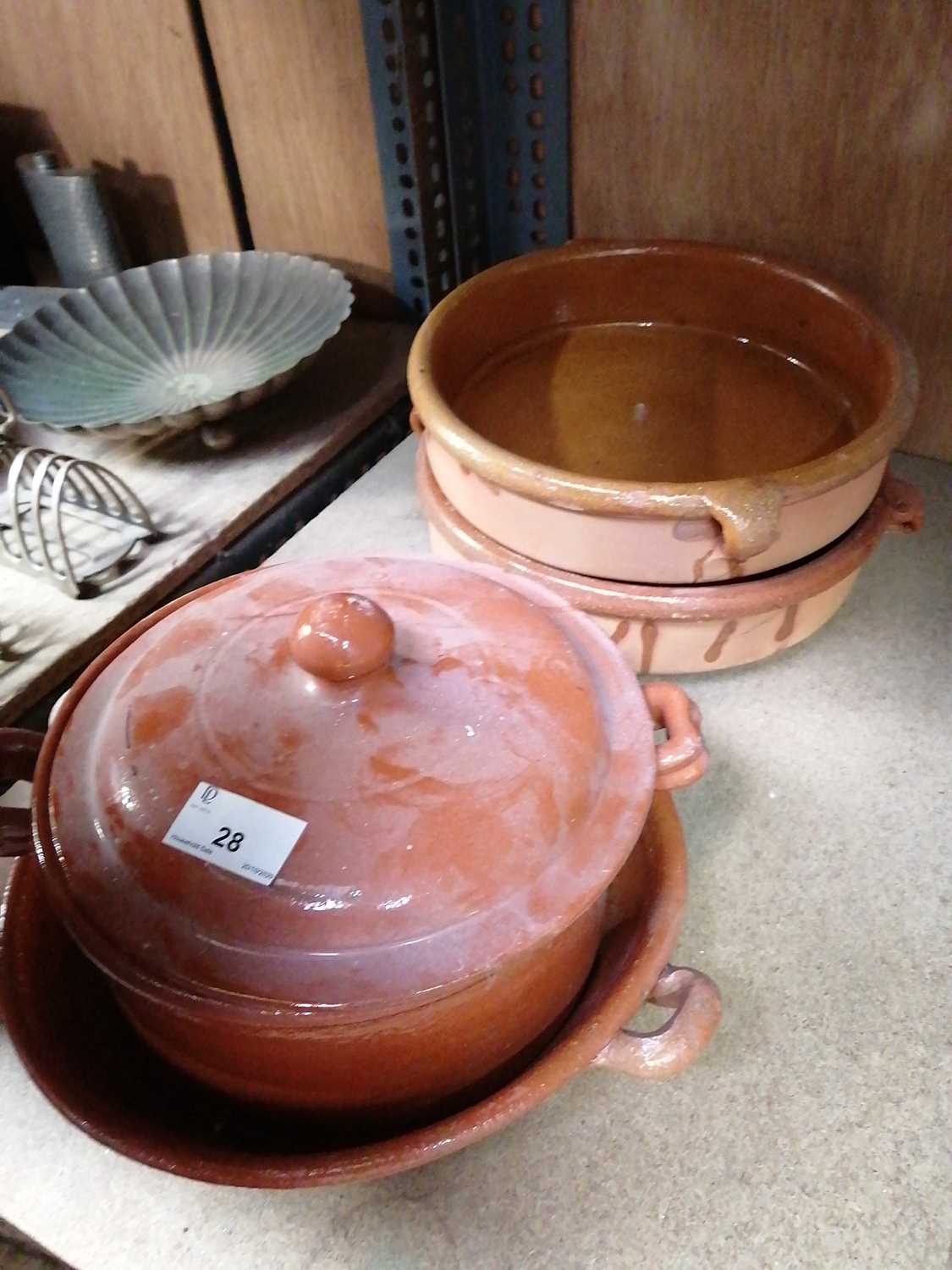 Lot 28 Earthenware cooking pot and dishes.